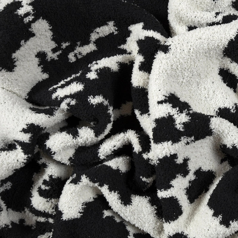 Carstens Black and White Cowhide Stretchy Throw